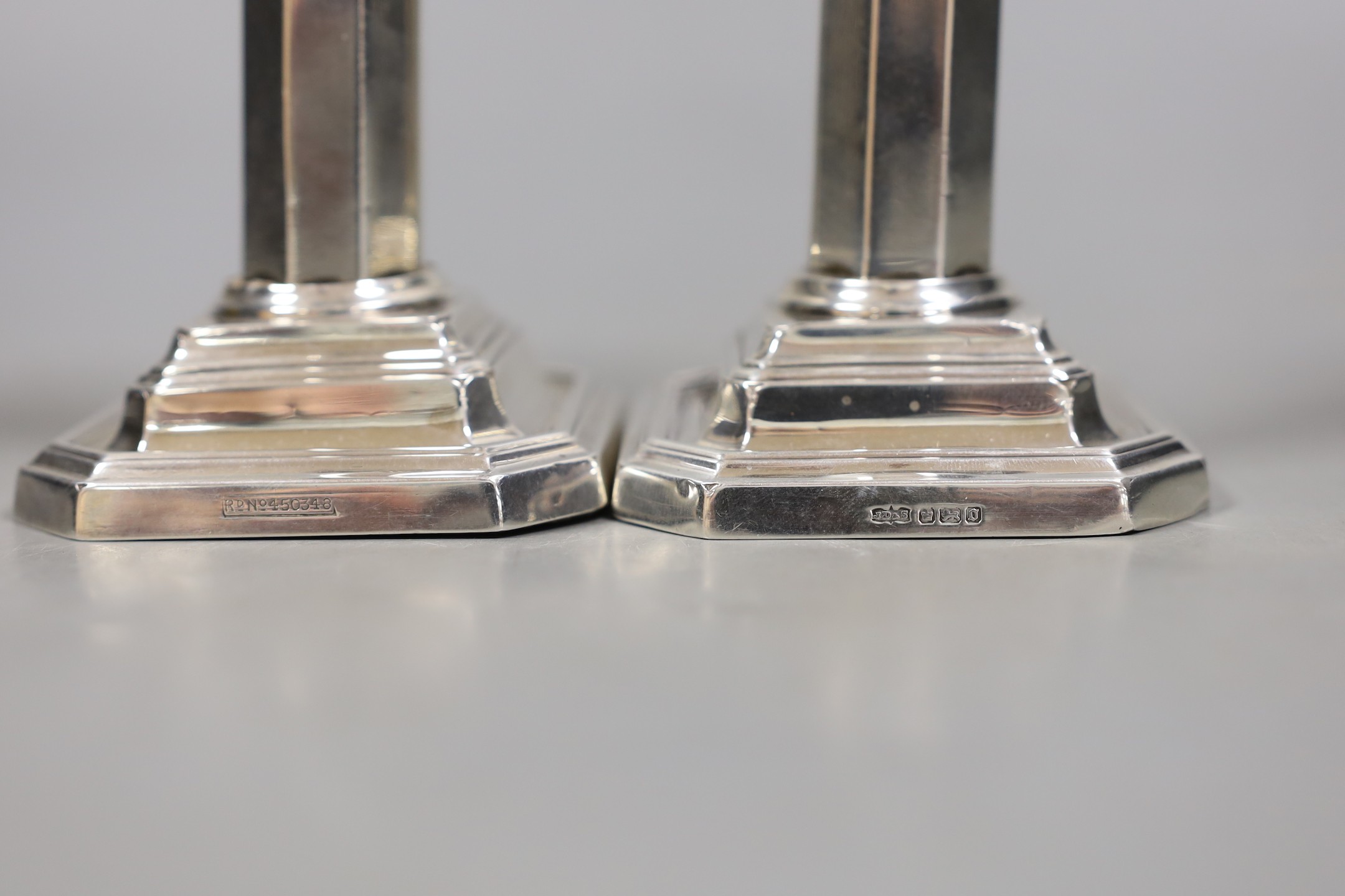 A pair of Edwardian silver dwarf candlesticks, James Dixon & Sons Sheffield, 1906, 10.7cm, weighted.